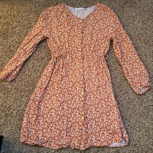 Tan floral sundress with long bishop sleeves and v-neck for casual occasions